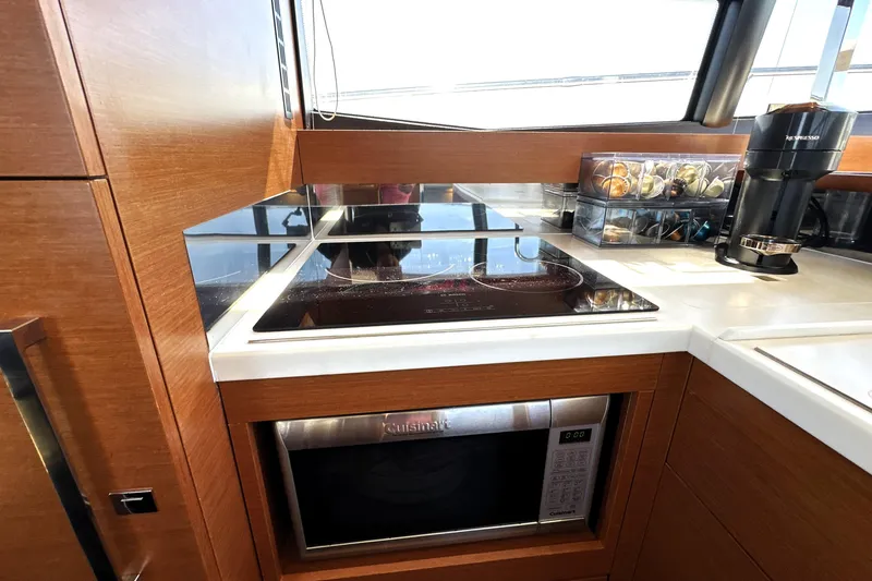 Eribella Yacht Photos Pics Modern kitchen in 2016 Prestige 500 S yacht with stove, microwave, and coffee maker.
