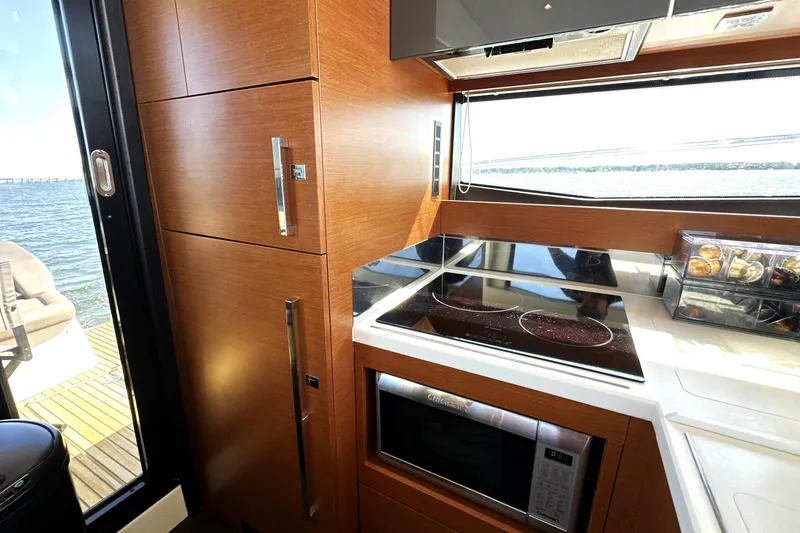 Eribella Yacht Photos Pics Modern kitchen interior on 2016 Prestige 500 S yacht with ocean view.