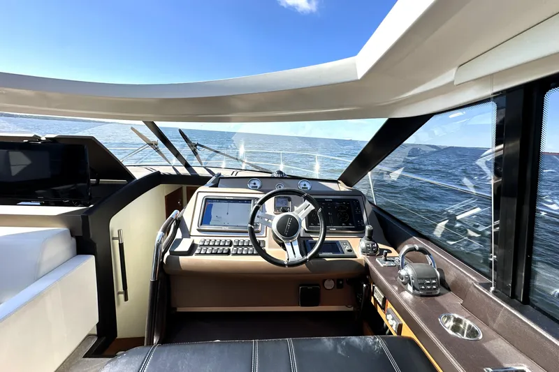 Eribella Yacht Photos Pics Cockpit of 2016 Prestige 500 S yacht with ocean view and modern controls.