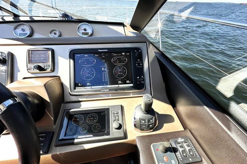 Eribella Yacht Photos Pics Control panel of a 2016 Prestige 500 S yacht with navigation displays.