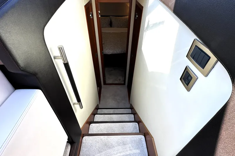 Eribella Yacht Photos Pics Staircase leading to cabin interior of 2016 Prestige 500 S yacht.