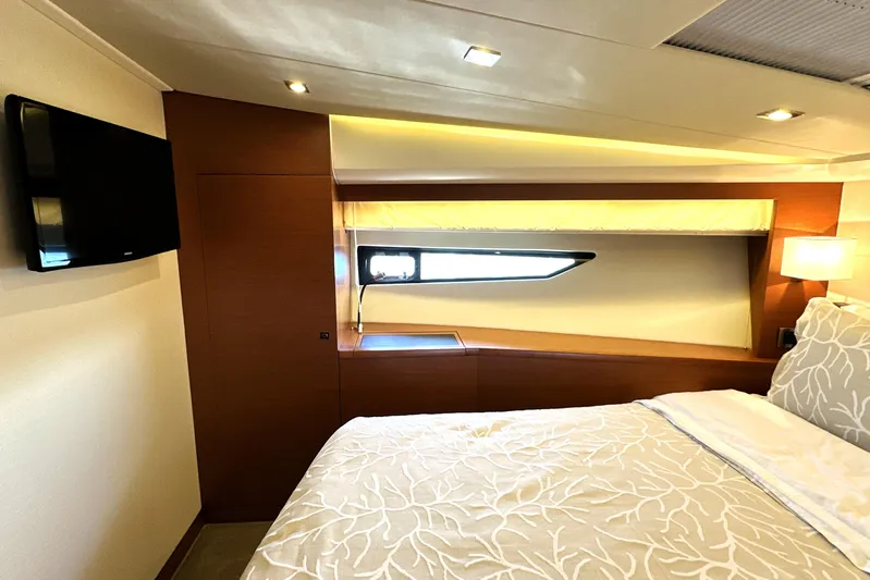Eribella Yacht Photos Pics Luxurious bedroom interior of 2016 Prestige 500 S yacht with modern design and cozy lighting.