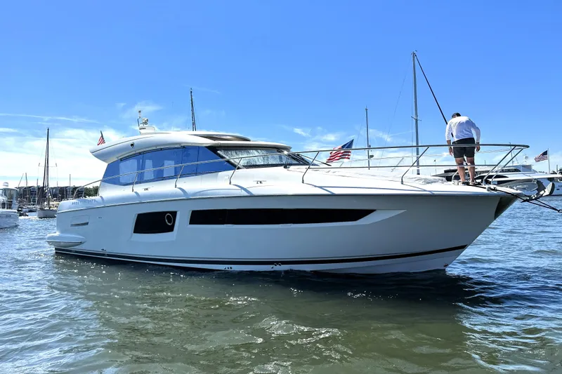 Eribella Yacht Photos Pics 2016 Prestige 500 S yacht docked in a marina under clear blue skies.