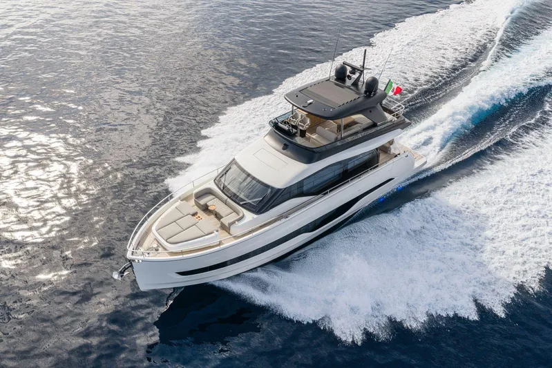  Yacht Photos Pics 2026 Cranchi 62 yacht cruising on open water, showcasing sleek design and luxury features.
