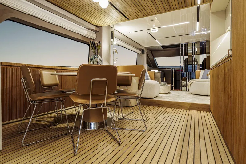  Yacht Photos Pics Luxurious interior of 2026 Cranchi 62 yacht with modern dining and seating area.
