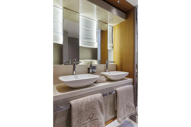  Yacht Photos Pics Luxurious bathroom in 2026 Cranchi 62 yacht with dual sinks and elegant design.