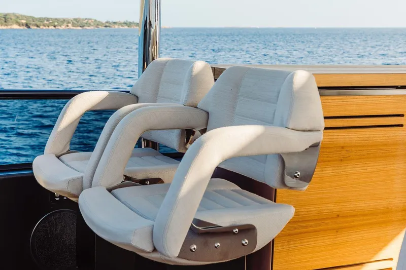  Yacht Photos Pics Luxury seating on Cranchi 62 yacht, 2026 model, overlooking serene ocean view.
