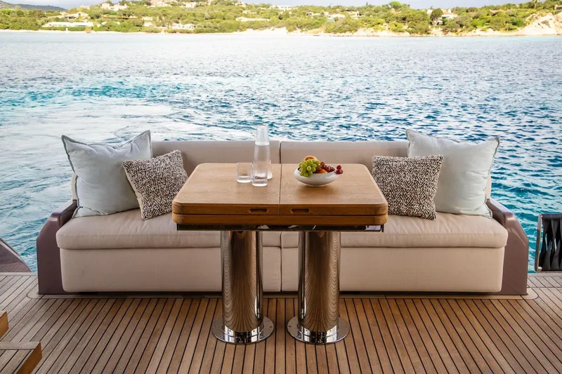  Yacht Photos Pics Luxurious 2026 Cranchi 62 yacht deck with elegant seating and ocean view.