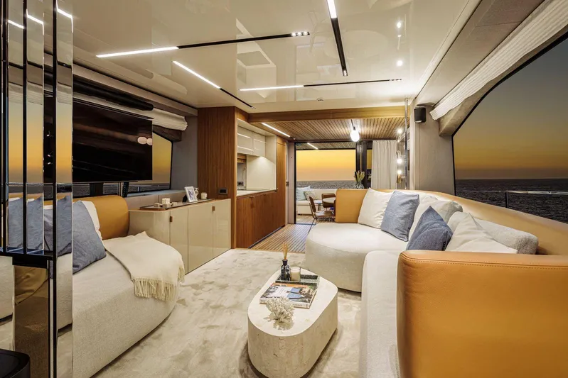  Yacht Photos Pics Luxurious interior of 2026 Cranchi 62 yacht with modern decor and ocean sunset view.
