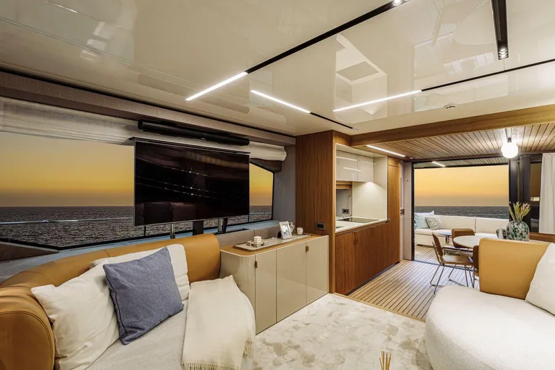  Yacht Photos Pics Luxurious interior of 2026 Cranchi 62 yacht with ocean view at sunset.