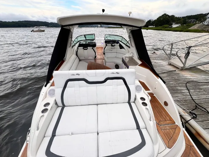  Yacht Photos Pics 2014 Sea Ray 350 SLX luxury boat with spacious seating, docked by the water.