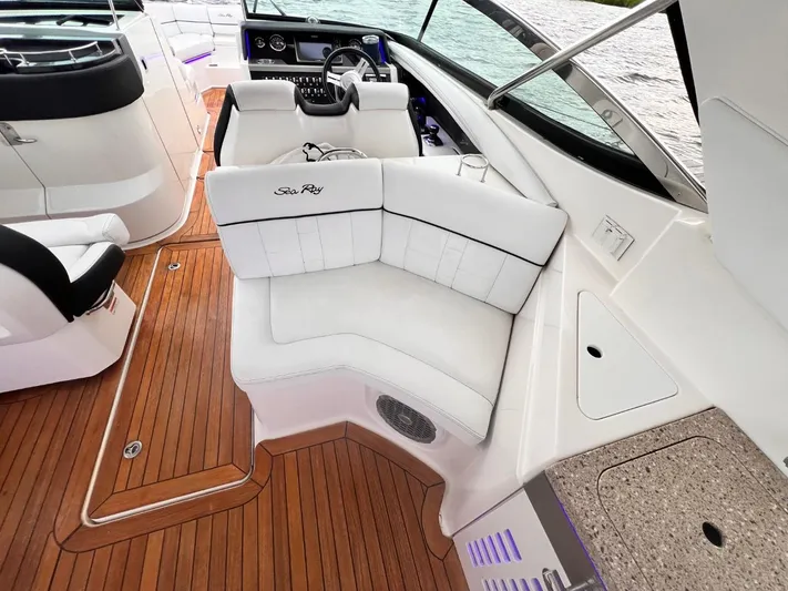  Yacht Photos Pics 2014 Sea Ray 350 SLX boat interior with white seating and wooden deck.