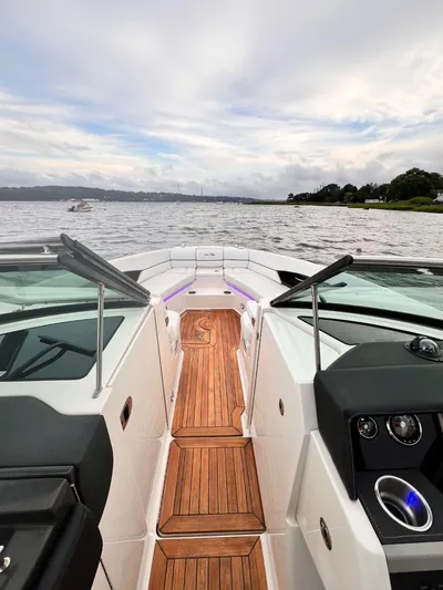  Yacht Photos Pics 2014 Sea Ray 350 SLX boat with wooden deck on a calm lake.