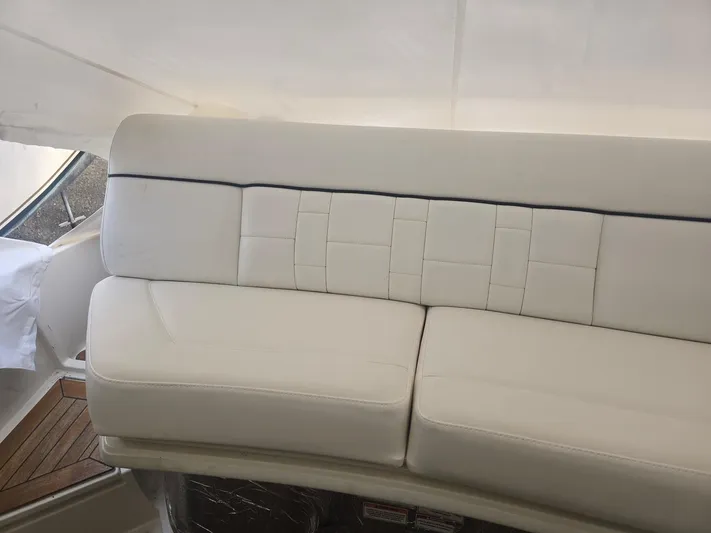  Yacht Photos Pics Luxurious white seating on 2014 Sea Ray 350 SLX boat interior.