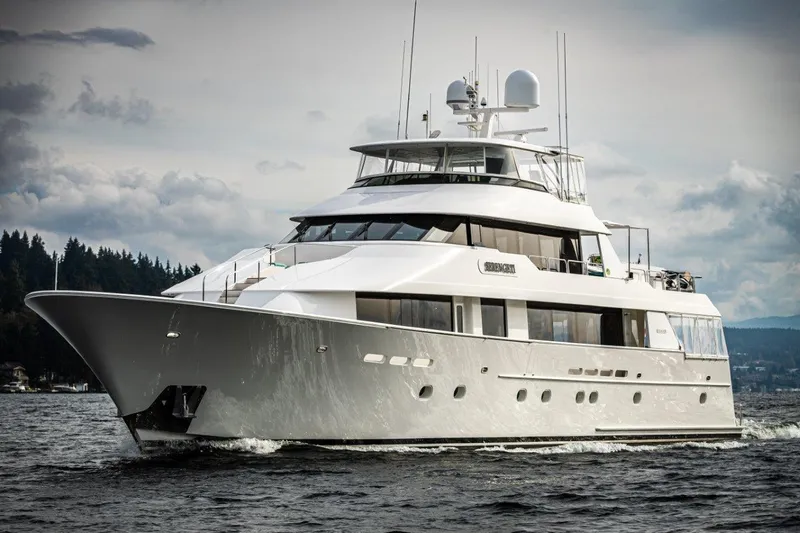 Serengeti Yacht Photos Pics Luxurious 2002 Westport Flybridge yacht cruising on open water.