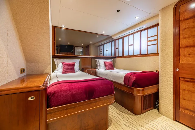 Serengeti Yacht Photos Pics Luxurious twin bedroom on a 2002 Westport Flybridge yacht with elegant wood finishes.