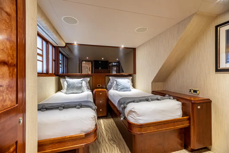 Serengeti Yacht Photos Pics Luxurious twin bedroom on a 2002 Westport Flybridge yacht with elegant wood finishes.