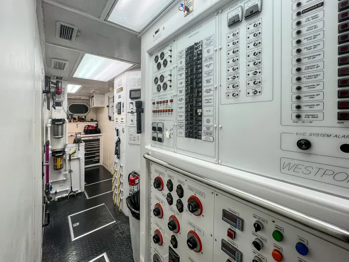 Serengeti Yacht Photos Pics Control room of a 2002 Westport Flybridge yacht with various panels and equipment.