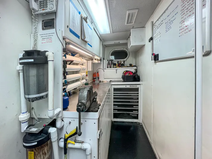 Serengeti Yacht Photos Pics Interior of a 2002 Westport Flybridge yacht's workshop area with tools and equipment.