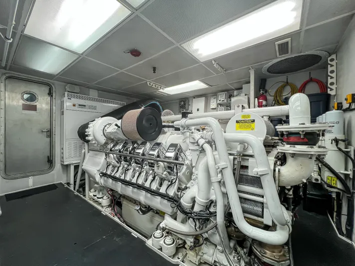 Serengeti Yacht Photos Pics Engine room of a 2002 Westport Flybridge yacht with a powerful marine engine.