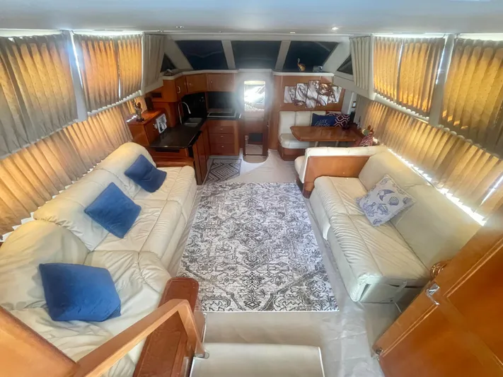  Yacht Photos Pics Luxurious interior of a 2004 Carver 44 Cockpit Motor Yacht with plush seating and elegant decor.