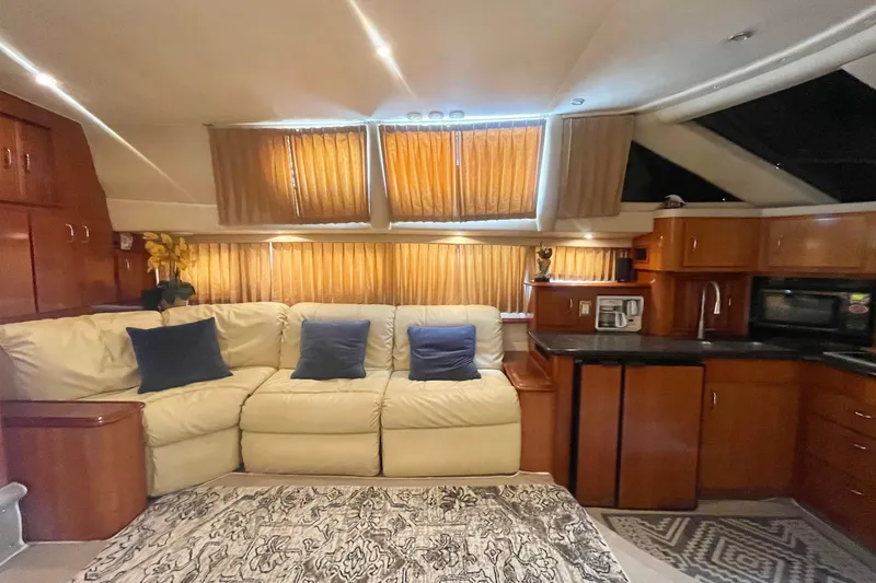  Yacht Photos Pics Luxurious interior of 2004 Carver 44 Cockpit Motor Yacht with cozy seating and modern amenities.