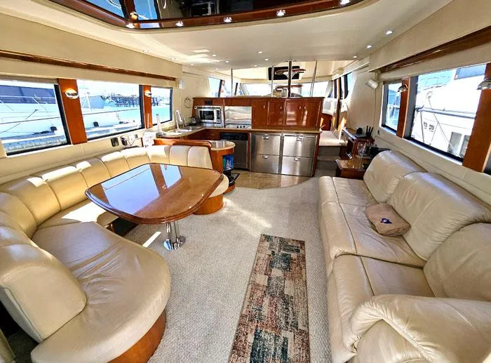  Yacht Photos Pics Luxurious interior of 2004 Carver 560 Voyager PH yacht with leather seating and modern kitchen.