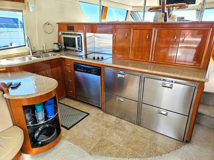  Yacht Photos Pics Luxurious kitchen interior of 2004 Carver 560 Voyager PH yacht with modern appliances.