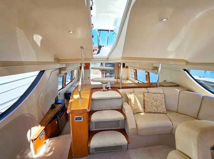  Yacht Photos Pics Luxurious interior of 2004 Carver 560 Voyager PH yacht with plush seating and elegant design.