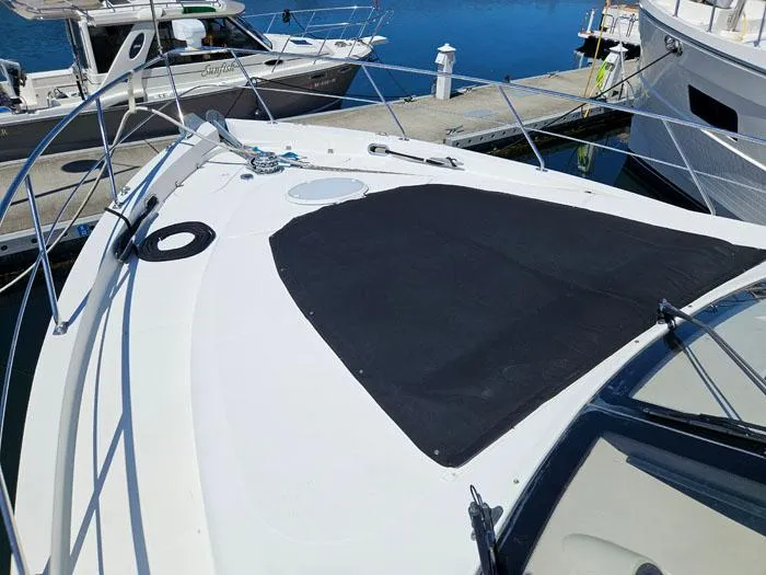  Yacht Photos Pics 2004 Carver 560 Voyager PH yacht docked at marina, featuring spacious deck and sleek design.