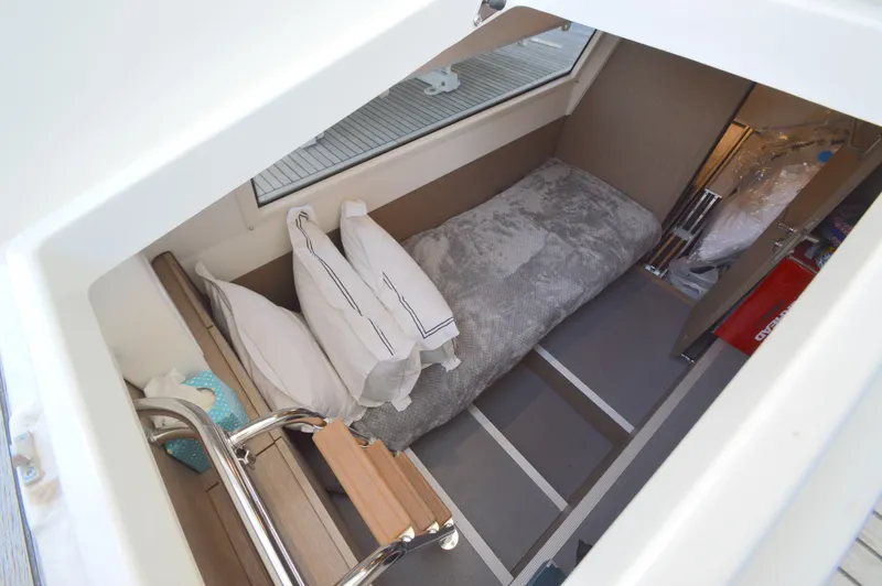 Yore Amuche Yacht Photos Pics Cozy cabin interior of 2019 Prestige 520S yacht with bed and pillows.