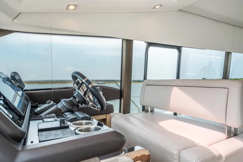 Yore Amuche Yacht Photos Pics Luxurious interior of 2019 Prestige 520S yacht with modern helm and seating.