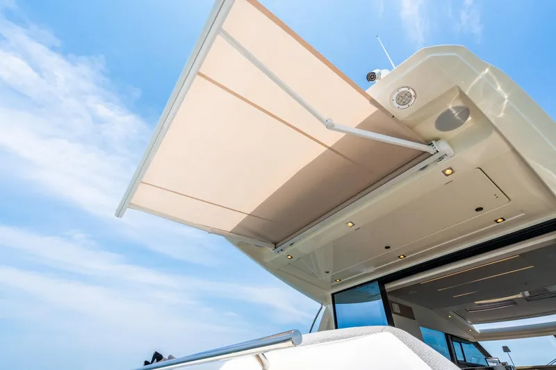 Yore Amuche Yacht Photos Pics 2019 Prestige 520S yacht with extended sunshade under clear blue sky.