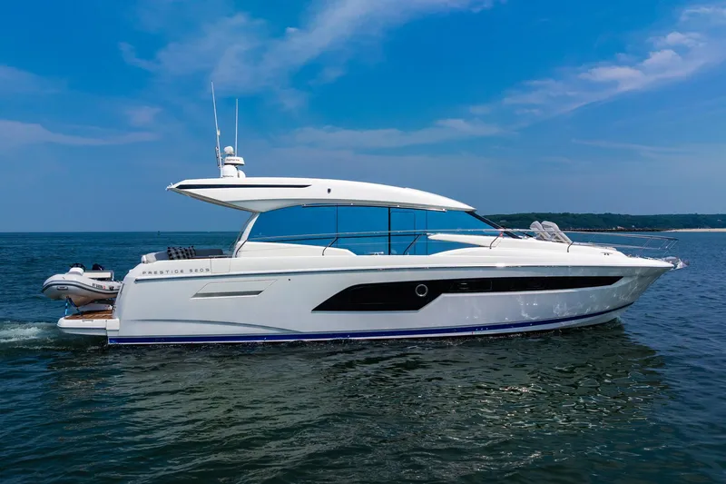 Yore Amuche Yacht Photos Pics 2019 Prestige 520S yacht cruising on calm blue waters under a clear sky.