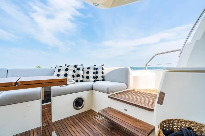 Yore Amuche Yacht Photos Pics Luxurious 2019 Prestige 520S yacht deck with comfortable seating and scenic ocean view.