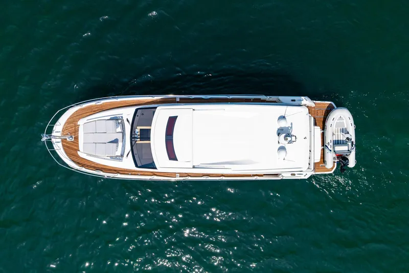 Yore Amuche Yacht Photos Pics Aerial view of 2019 Prestige 520S yacht on blue water.