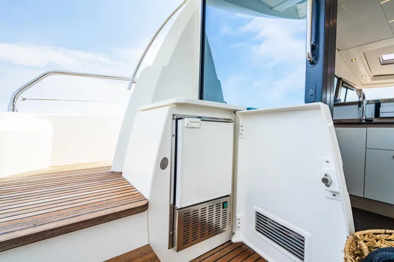 Yore Amuche Yacht Photos Pics 2019 Prestige 520S yacht interior with open door, showcasing sleek design and wooden flooring.