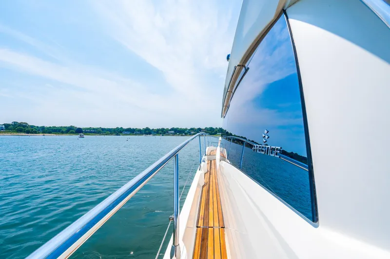 Yore Amuche Yacht Photos Pics 2019 Prestige 520S yacht cruising on serene waters under a clear blue sky.