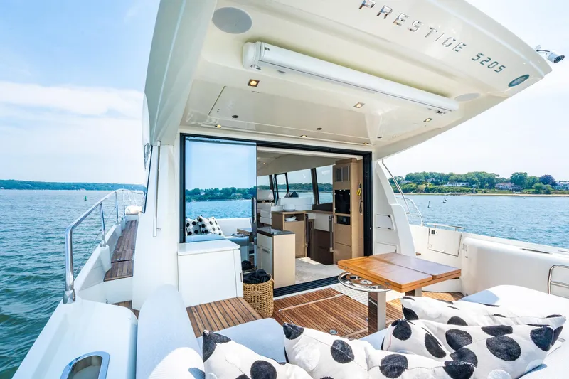 Yore Amuche Yacht Photos Pics Luxurious 2019 Prestige 520S yacht interior with open deck, scenic water view.