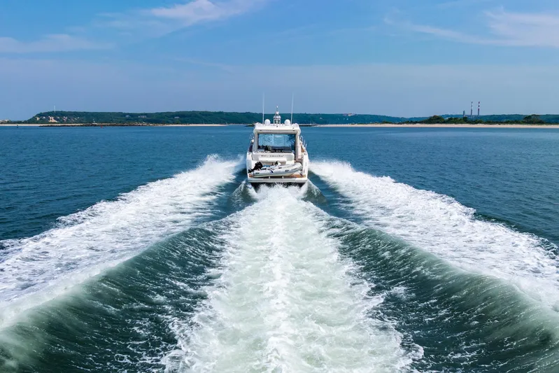 Yore Amuche Yacht Photos Pics 2019 Prestige 520S yacht cruising on open water, leaving a wake behind.