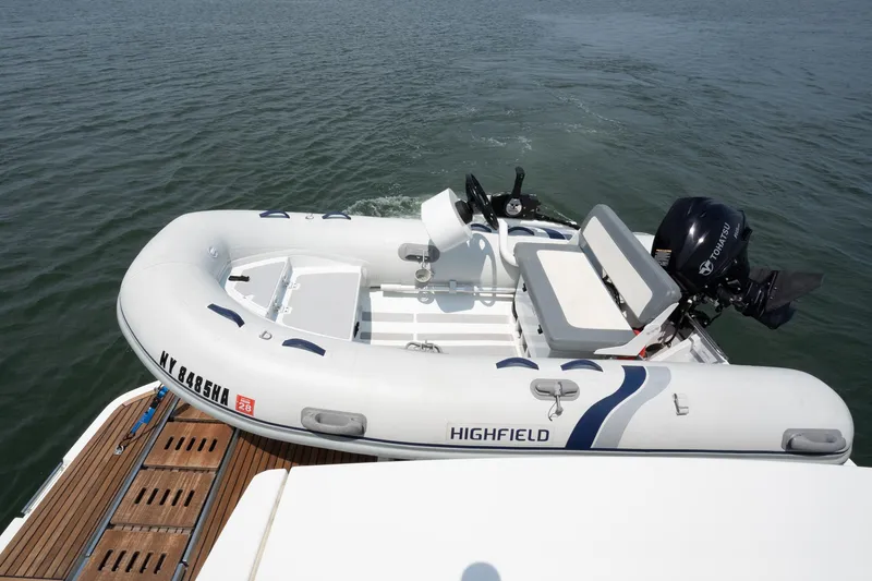 Yore Amuche Yacht Photos Pics Inflatable boat with Tohatsu motor on Prestige 520S yacht, 2019 model, on water.