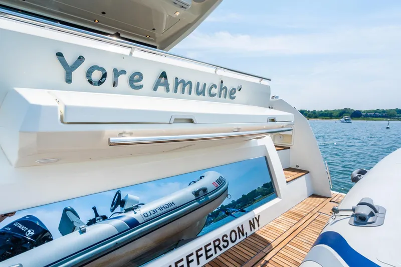 Yore Amuche Yacht Photos Pics 2019 Prestige 520S yacht with tender, docked in Jefferson, NY, on a sunny day.