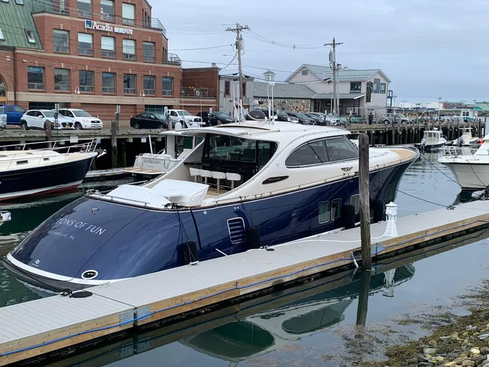 Tons Of Fun Yacht Photos Pics 2022 Zeelander Z72 yacht docked at a marina, showcasing sleek design and luxury features.