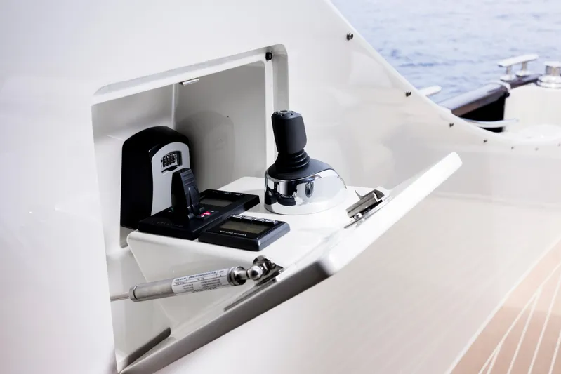 Tons Of Fun Yacht Photos Pics Control panel on a 2022 Zeelander Z72 yacht, featuring joystick and electronic controls.