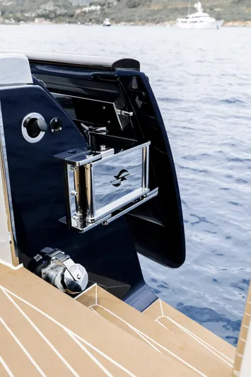 Tons Of Fun Yacht Photos Pics 2022 Zeelander Z72 yacht detail with sleek chrome accents and ocean backdrop.