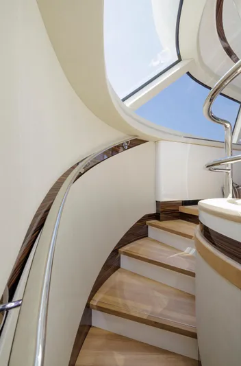 Tons Of Fun Yacht Photos Pics Elegant staircase inside 2022 Zeelander Z72 yacht, featuring sleek design and modern finishes.