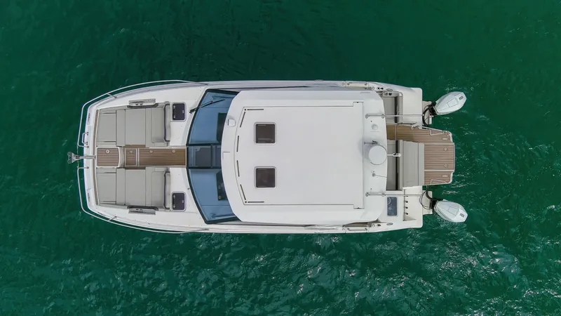  Yacht Photos Pics Aerial view of 2023 Aquila 36 Sport boat on green water.