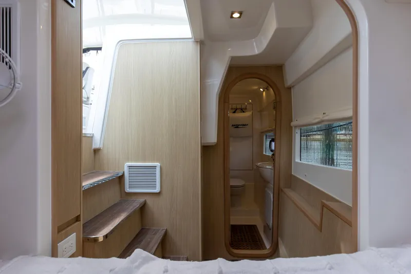  Yacht Photos Pics Interior of 2023 Aquila 36 Sport yacht, featuring modern design and wooden accents.