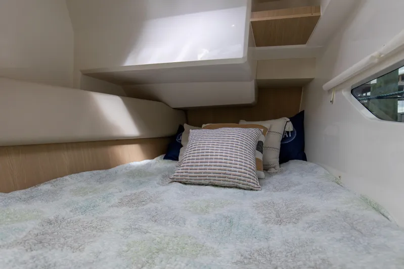  Yacht Photos Pics Cozy cabin interior of 2023 Aquila 36 Sport with comfortable bedding and pillows.