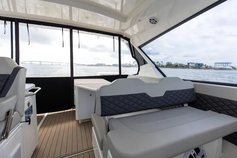  Yacht Photos Pics Interior of 2023 Aquila 36 Sport boat with seating and water view.